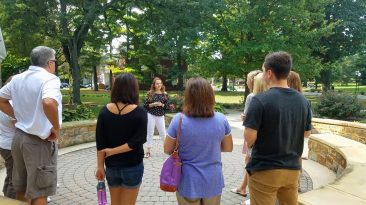 Visitors taking a tour of a college campus