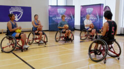 Para-athletes playing basketball