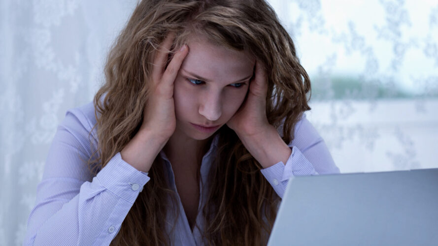 A young woman looking stressed