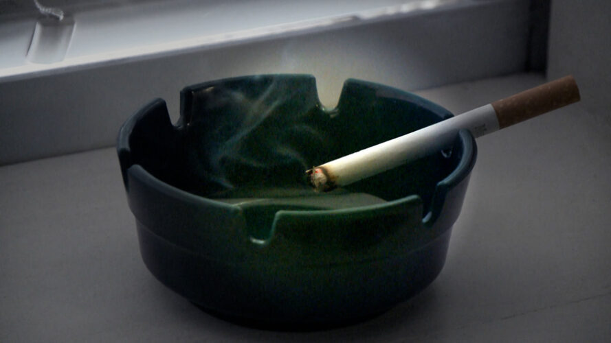 An ashtray with a cigarette in it