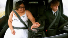 A bride and groom in a car