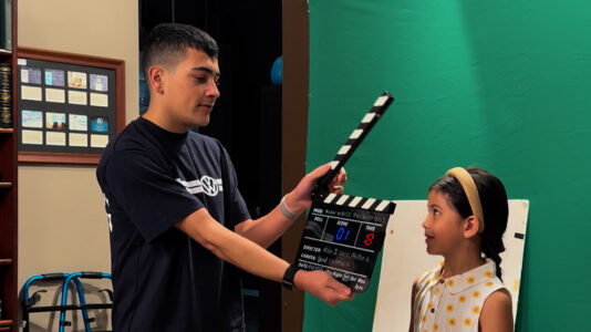 Contest winner Huston with has clapboard