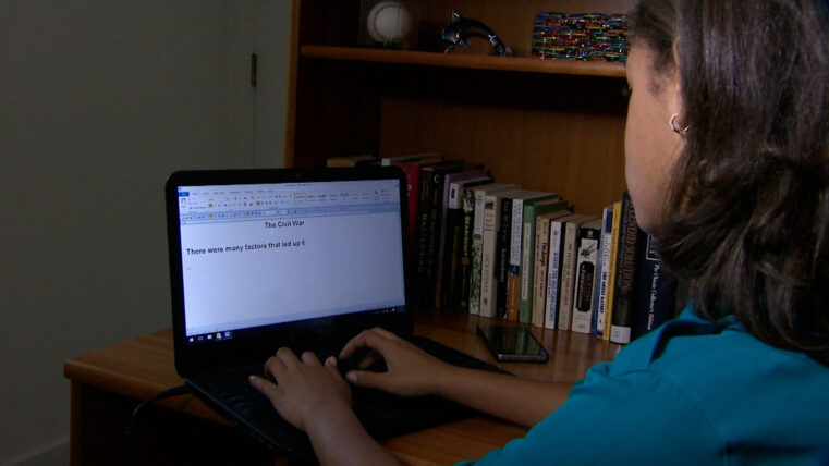 writing at a computer